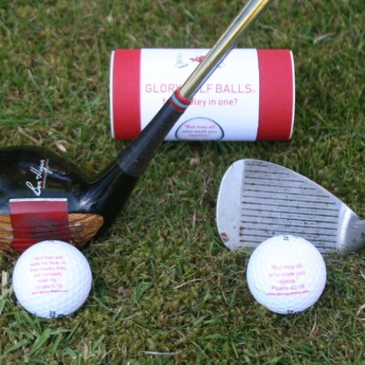 Set of two balls with golf clubs and tube