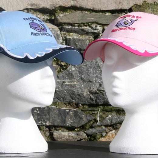 Blue and pink caps on heads
