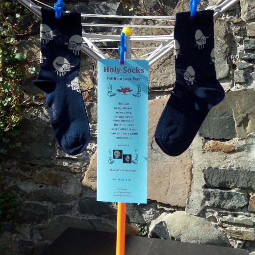 Pharaoh's Cows with leaflet on toy whirling washing line. 